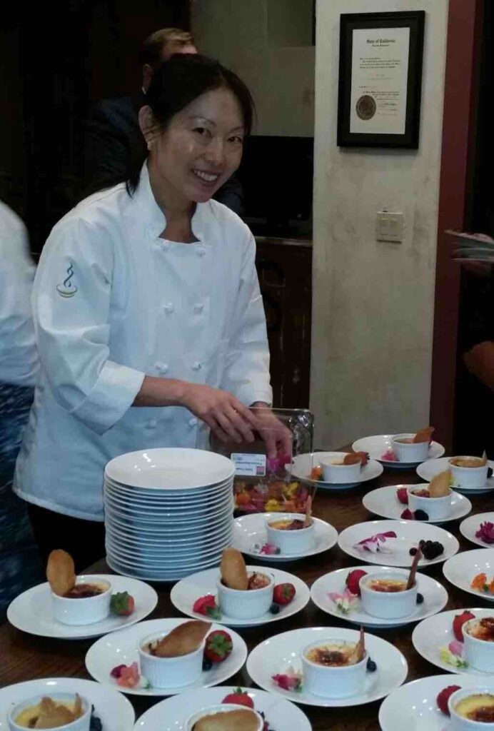 Cynthia Liu plating desserts at a culinary event